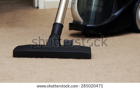 closeup of the vacuum on the carpet