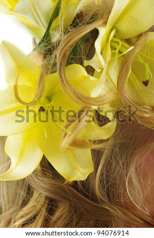 closeup of beautiful lilies flowers in hair