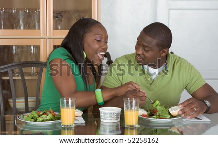 Young Black African American Couple Sitting By Glass Table And Eating ...