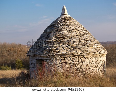 old stone house used as a shelter for people and cattle