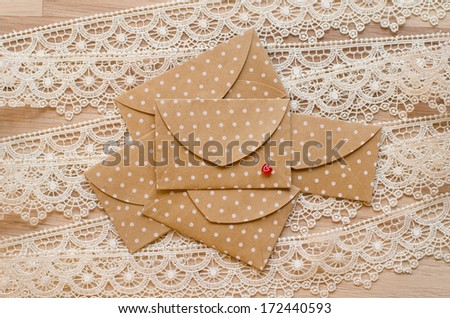 five St. Valentine\'s day envelopes on lace background