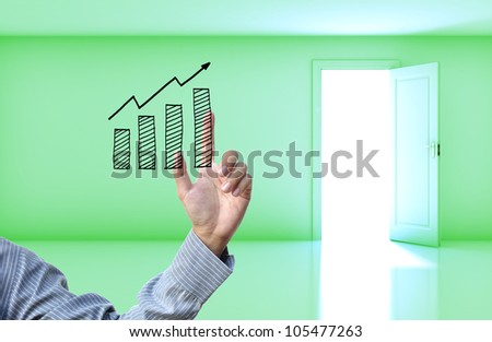Business concept with business hand on green empty room open door  background.