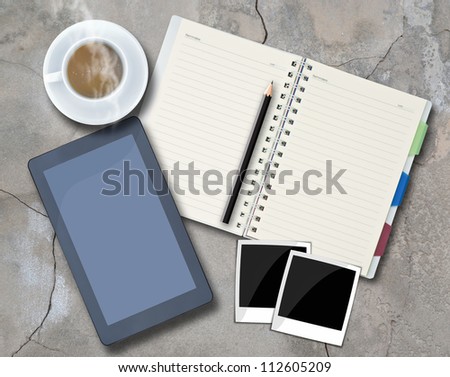 Office objects , notepad, tablet computer, photo frames, coffee cup on background.