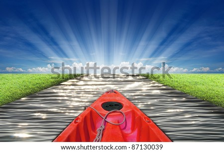 Head of red kayak in the ocean for destination idea.