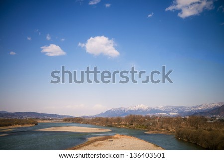 Dried river during winter in Japan with mountain view.