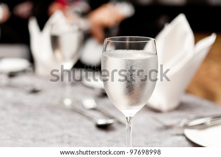 Glass of water on luxury table setting for dining