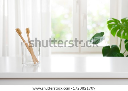 Similar – Image, Stock Photo Wooden toothbrushes with dental floss.