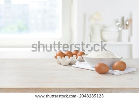 Similar – Image, Stock Photo Brown eggs and baking ingredients on a kitchen table. Rustic style.