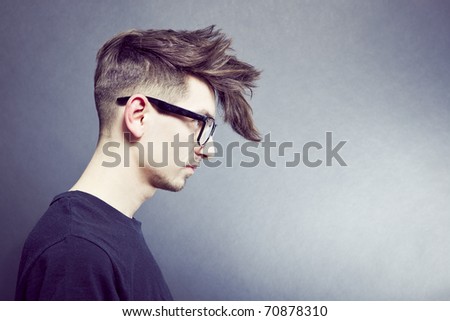 Close-up portrait of young male model with stylish hair