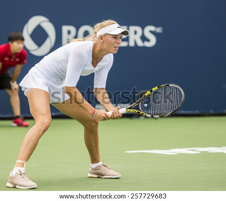 MONTREAL - AUGUST 7: Caroline Wozniacki of Denmark in her third round match win over Shelby Rogers of USA at the 2014 Rogers Cup on August 7, 2014 in Montreal, Canada