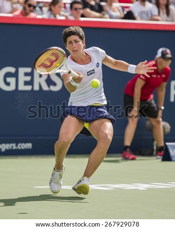 MONTREAL - AUGUST 7: Carla Suarez Navarro of Spain in her Third round match win over Maria Sharapova of Russia at the 2014 Rogers Cup on August 7, 2014 in Montreal, Canada