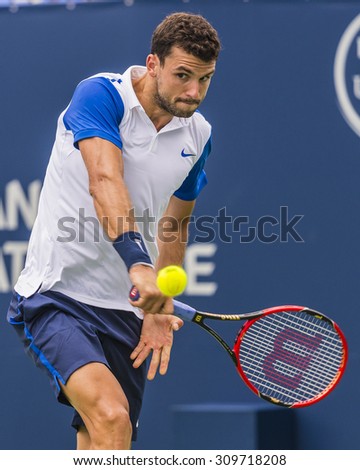 MONTREAL - AUGUST 11: Grigor Dimitrov of Bulgaria during his first round win over Alexandr Dolgopolov of Ukraine at the 2015 Rogers Cup on August 11, 2015 in Montreal, Canada