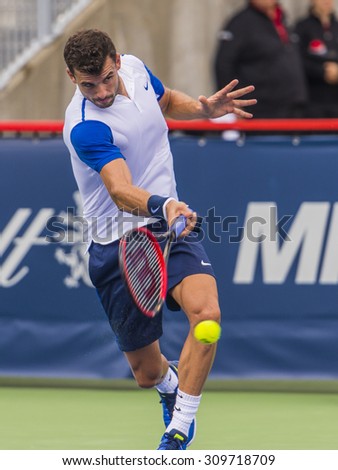 MONTREAL - AUGUST 11: Grigor Dimitrov of Bulgaria during his first round win over Alexandr Dolgopolov of Ukraine at the 2015 Rogers Cup on August 11, 2015 in Montreal, Canada