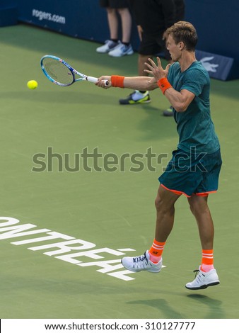 MONTREAL - AUGUST 12: Tomas Berdych of Czech Republic during his second round match loss to Donald Young of USA at the 2015 Rogers Cup on August 12, 2015 in Montreal, Canada