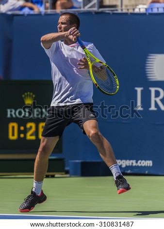 MONTREAL - AUGUST 12: Mikhail Youzhny of Russia during his second round match win over Gilles Simon of France at the 2015 Rogers Cup on August 12, 2015 in Montreal, Canada