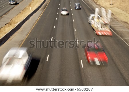 rear view of quick blurred cars