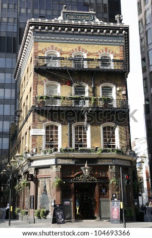 LONDON - MARCH 25: Exterior of pub, for drinking and socializing, focal point of community, on March 25, 2012, London, UK. Pub business, now about 53,500 pubs in the UK, has been declining every year