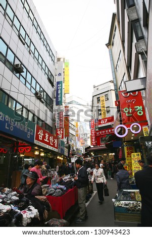 SEOUL - APRIL 21: Street view of Nam Dae Mun Market, crowd present, on April 21, 2011, Seoul, South Korea. This is the oldest, dates back to 1414, and largest traditional market in South Korea.