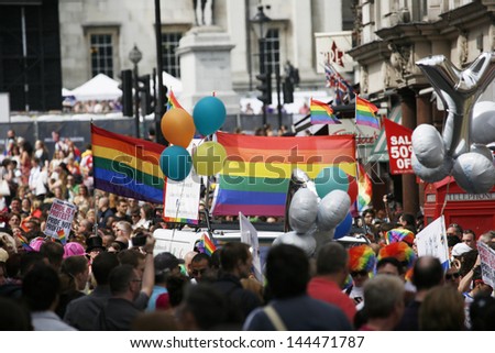 LONDON - JUNE 29: Rainbow flag in London\'s Gay Pride, on June 29, 2013 in London, UK, estimated 25,000 people took part in the march, Parade to support gay rights.