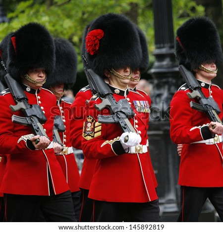LONDON - JUNE 15: Queen\'s Soldier at Queen\'s Birthday Parade on June 15, 2013 in London, UK. Queen\'s Birthday Parade take place to Celebrate Queen\'s Official Birthday in every June in London.