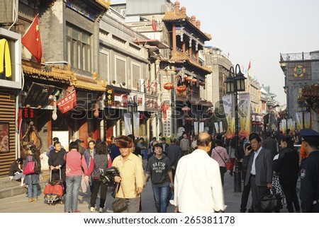 BEIJING - OCT 17: Street view of Dazhalan Market, crowd present, on Oct 17, 2014, Beijing, China. This is famous business street outside Qianmen, one of the largest traditional market in Beijing.