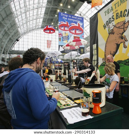 LONDON - AUGUST 17: Great British Beer Festival, at Kensington Olympia, Britain\'s biggest beer festival on Aug 17, 2013 in London, UK. Visitors can try wide range of real ales, ciders, perries.