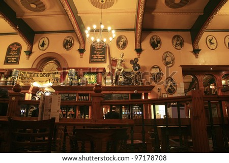 LONDON - OCT 28: Interior of pub, for drinking and socializing, focal point of the community, on Oct 28, 2010, London, UK. Pub business, now about 53,500 pubs in the UK, has been declining every year