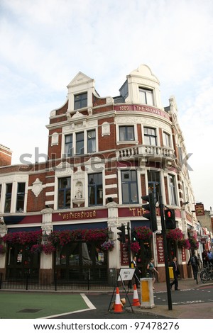 LONDON - AUG 20: Exterior of pub, for drinking and socializing, focal point of the community, on Aug 20, 2010, London, UK. Pub business, now about 53,500 pubs in the UK, has been declining every year