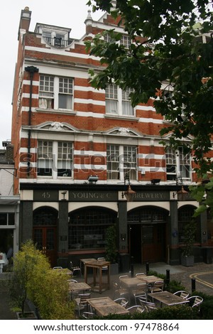 LONDON - JULY 18: Exterior of pub, for drinking and socializing, focal point of the community, on July 18, 2010, London, UK. Pub business, now about 53,500 pubs in UK, has been declining every year