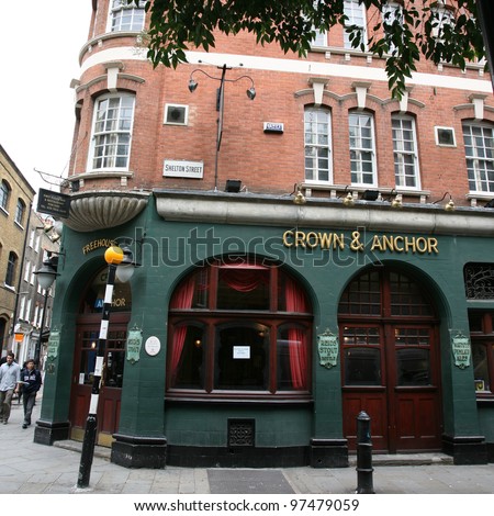 LONDON - AUG 16: Exterior of pub, for drinking and socializing, focal point of the community, on Aug 16, 2010, London, UK. Pub business, now about 53,500 pubs in the UK, has been declining every year