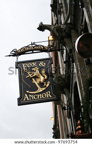 LONDON - APRIL 9: English pub sign, Public house, known as pub, is focal point of the community, on April 9, 2006, London, UK. Pub business, now about 53,500 pubs in UK, has been declining every year