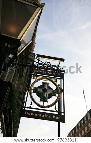LONDON - OCT 18: English pub sign, Public house, known as pub, is focal point of the community, on Oct 18, 2010, London, UK. Pub business, now about 53,500 pubs in UK, has been declining every year