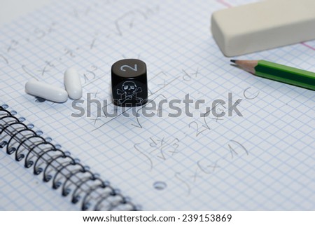 study place with painkillers in background and skull dice - stock photo