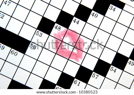 Woman loves crossword puzzles so much she has left a red kiss across the middle of puzzle.