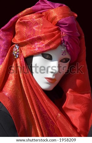 woman dressed for Carnival with Red scarf and jewels with mask