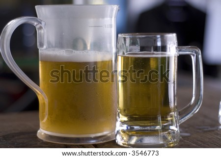 jug of beer and a mug of beer