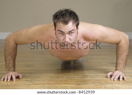 young man doing push ups
