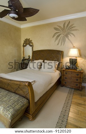 bedroom decorated in tropical style with fan