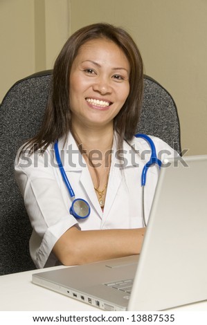 Smiling and conident female Asian Doctor.