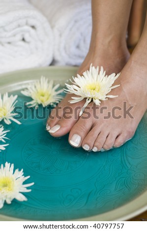 Feet enjoy a relaxing aromatherapy foot soak at day spa