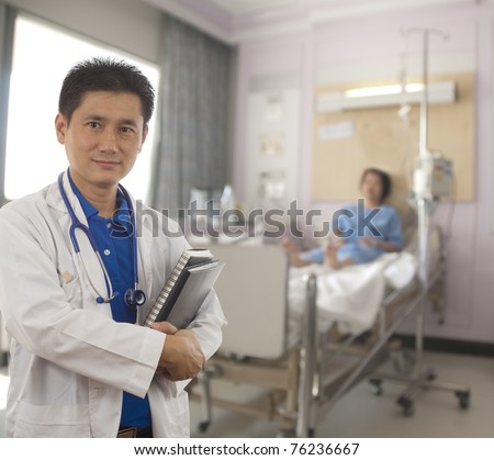 Doctor with patient in hospital room