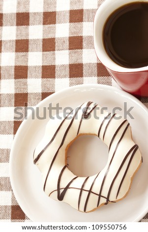Donut and red coffee cup