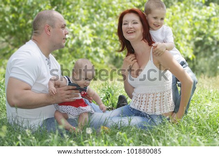 young happy family on natural background