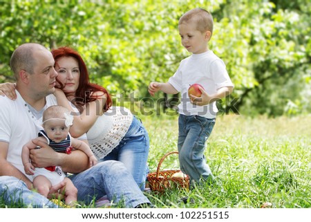 young happy family on natural background