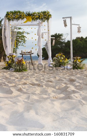 wedding arch - tent - decorated with flowers on beach, tropical wedding ceremony set up