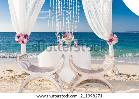 beach wedding set up, tropical outdoor wedding reception, beautiful cabana, wedding arch
