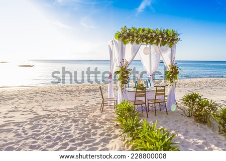 wedding arch and set up on beach, tropical outdoor wedding cabana on beach, wedding table for dinner