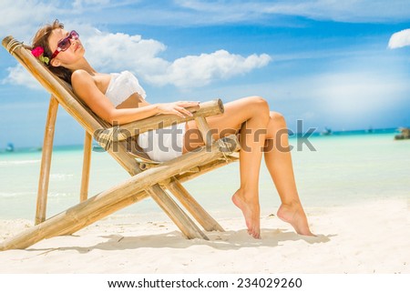 young happy beautiful woman outdoor portrait, tropical sand beach and sky background