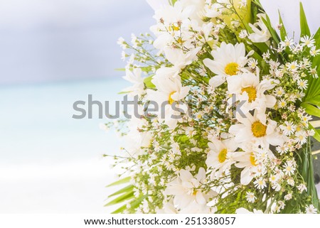 white flowers on wedding cabana on natural outdoor background