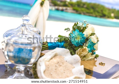 beach wedding venue, wedding setup, cabana, arch, gazebo, wedding bouquet